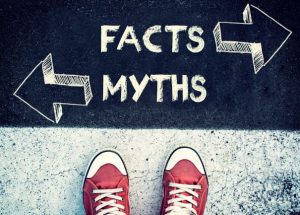 Sign pointing in different directions for myths and facts